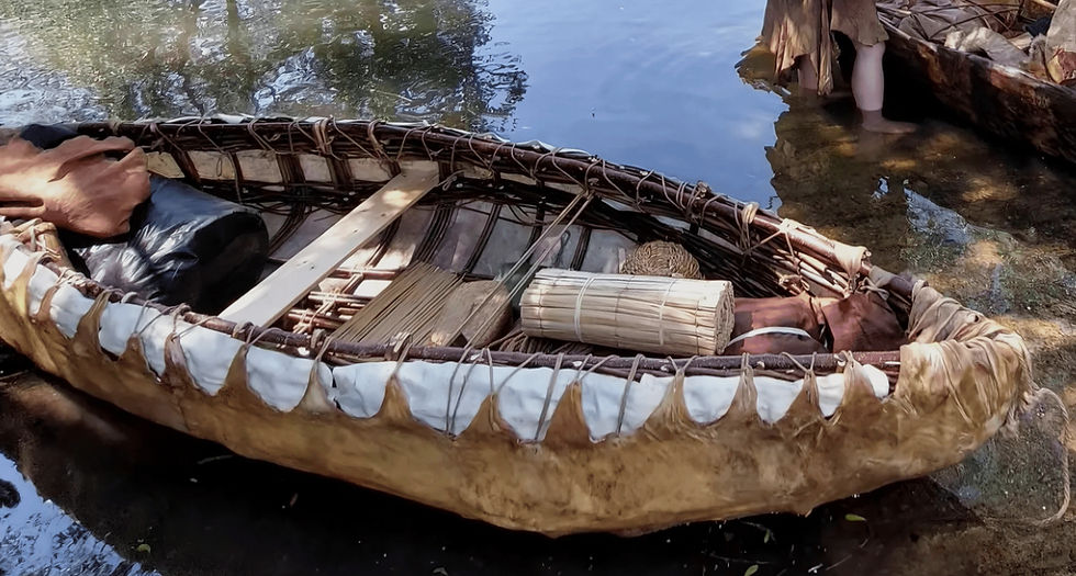 Theresa Emmerich Kamper's hide boat on water with tools.
