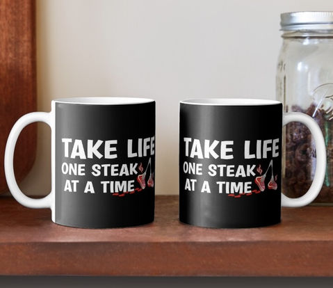 The 'Take Life One Steak At A Time' graphic is available on t-shirts, accessories, home decor and more. 