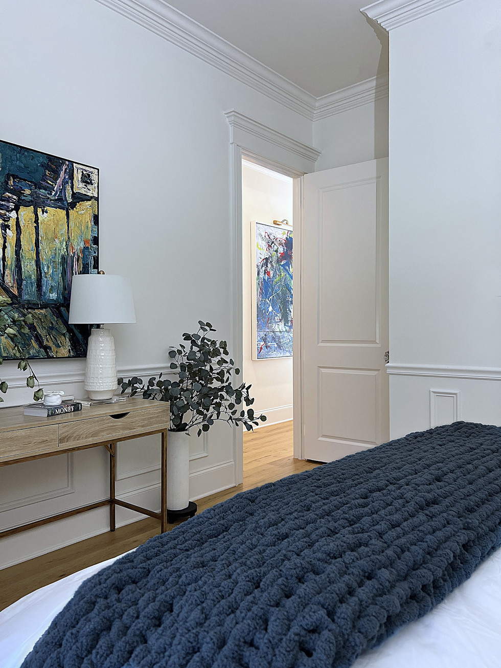 a bedroom with a blue blanket on the bed