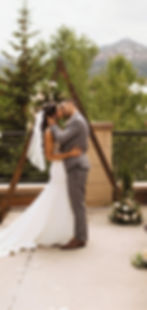 Mountain Arbor with a bride and groom kissing