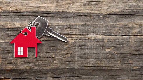 Symbol of the house with silver key on vintage wooden background .jpg