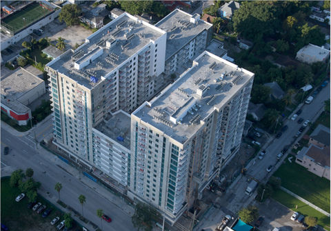 Aerial view of the Urban 22 mid-rise residential building construction site, showcasing the completed concrete structural framework in Miami.