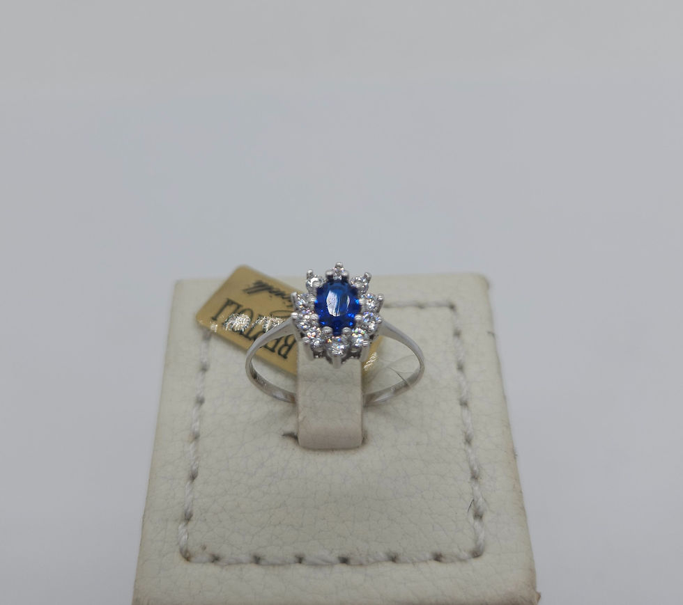 Anello a rosa in oro bianco 18K con zaffiro blu e zirconi