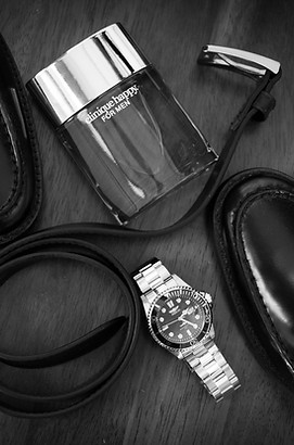 perfume and watch shot at the wedding