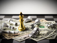 Chess king standing on U.S. dollar bills symbolizing high interest rates shaping the 2026 cement and construction market outlook