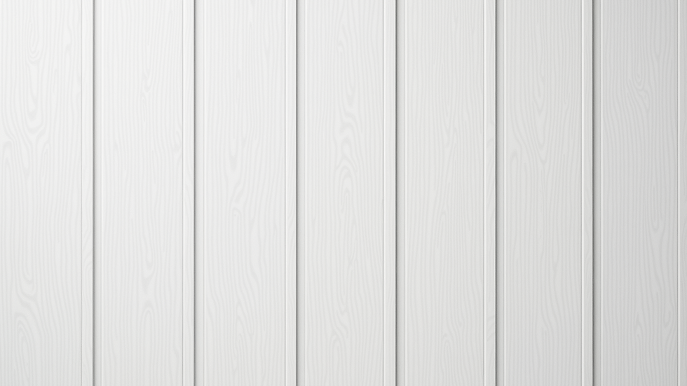 Close-up view of white PVC wall panel with wood grain texture