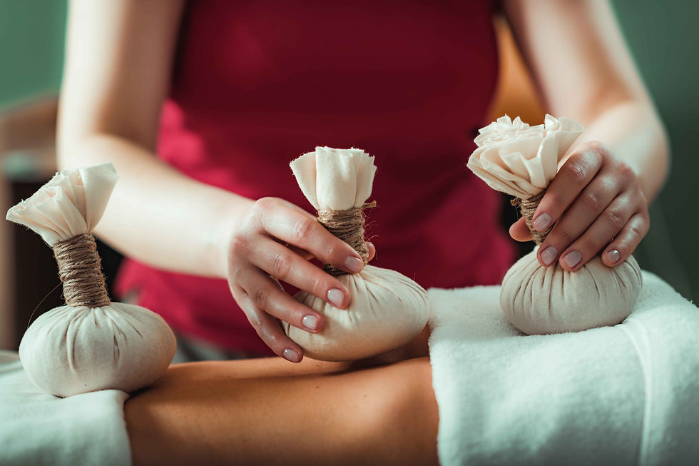 Thai herbal compress massage treatment for muscle relaxation