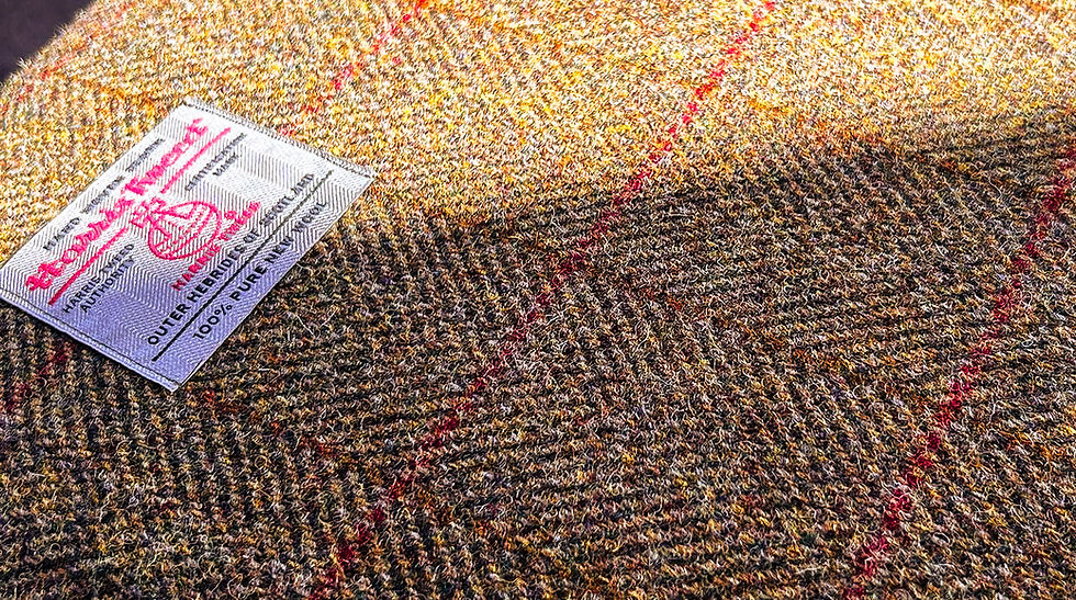 Thumbnail: Harris Tweed 100% PURE NEW WOOL label on herringbone fabric