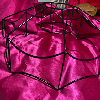 A bare lampshade frame