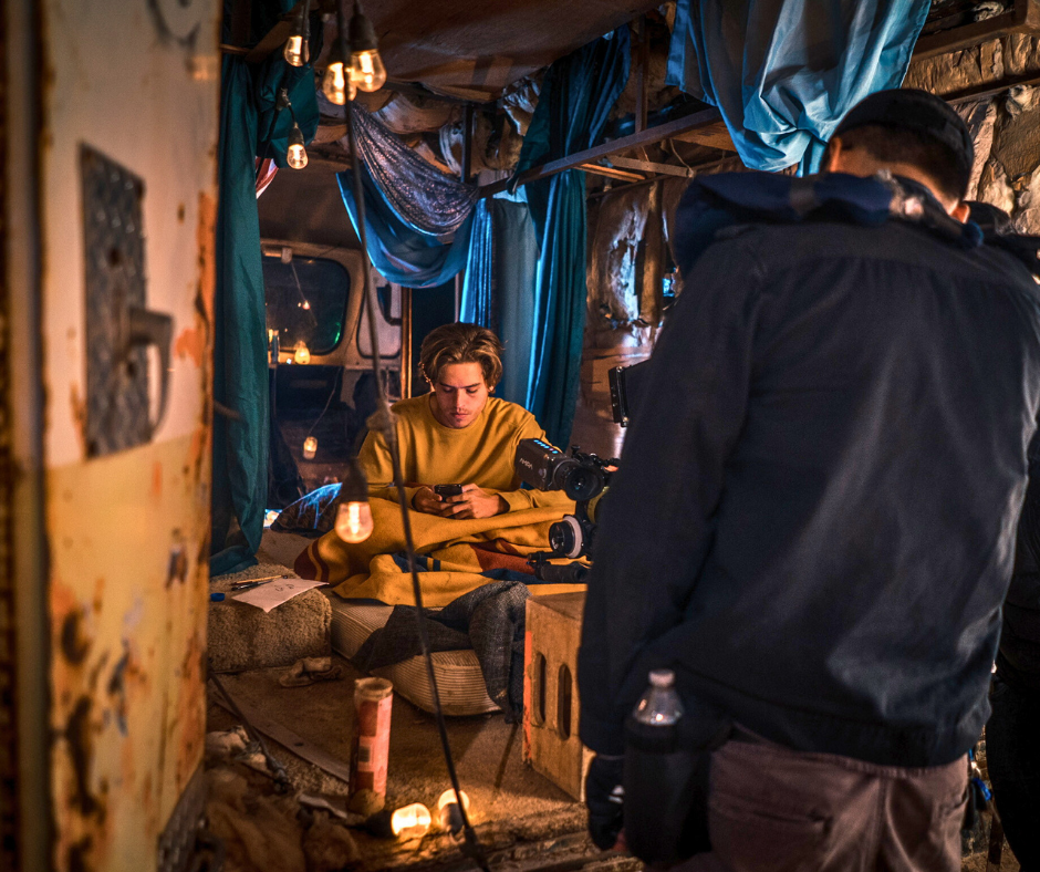 Close-up view of a flickering neon sign in a dark alley