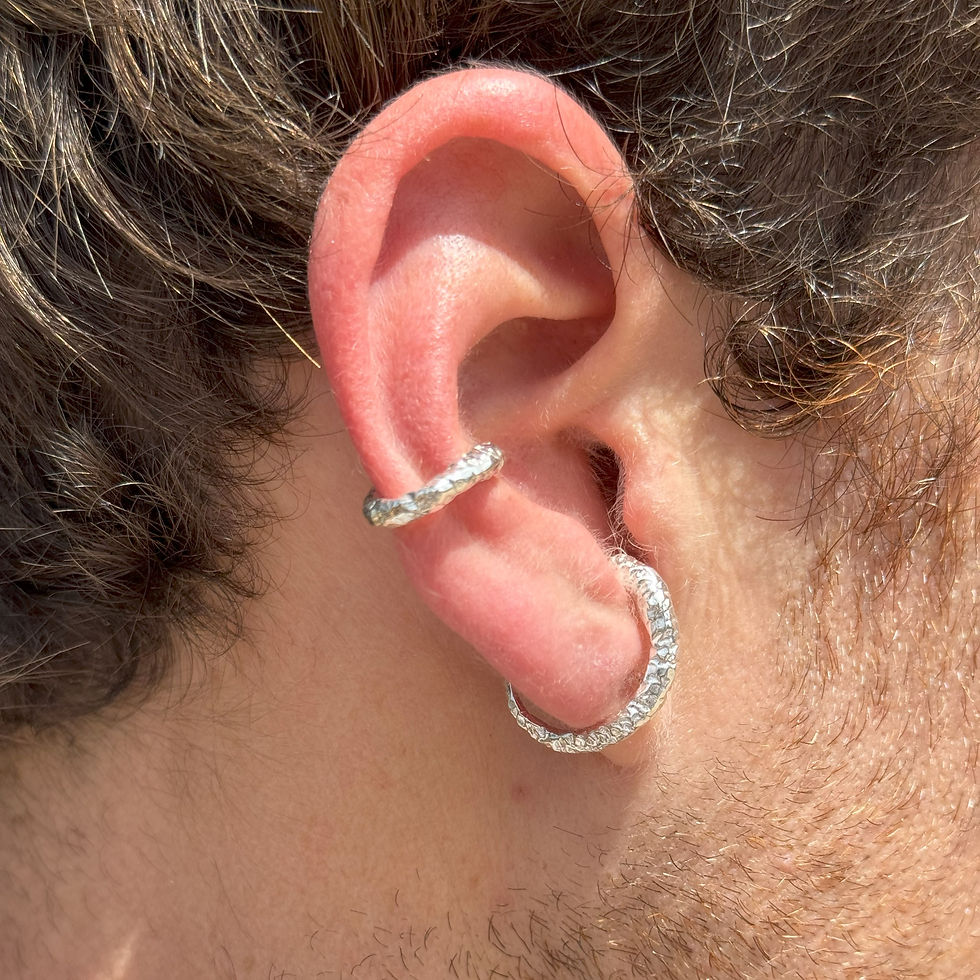 Thumbnail: Textured silver hoop and ear cuff on an ear