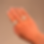 silver ring featuring the word “OK” in chunky design worn on  fingers, shown against a plain background