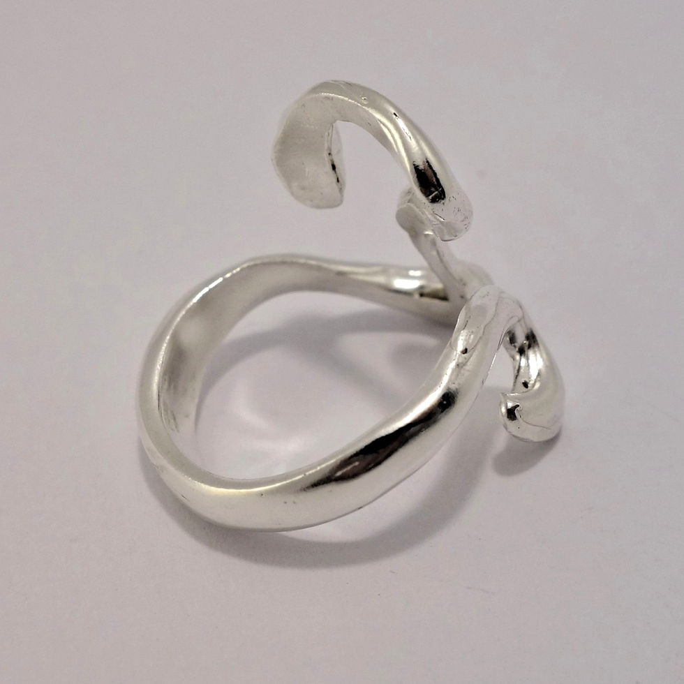 Thumbnail: Open silver ring with bold, flowing curves in an abstract design.