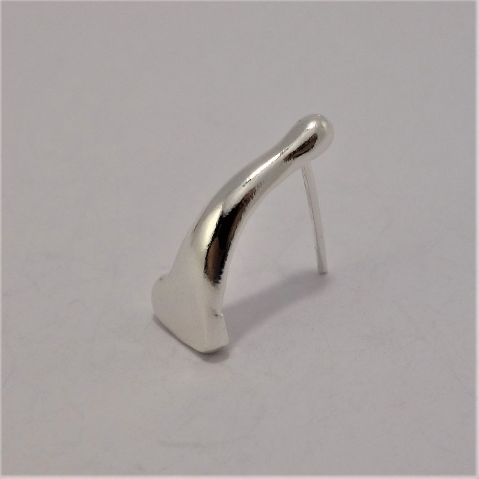 Thumbnail: Side view of a silver droplet-shaped earring with a smooth sculptural curve