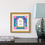 Thumbnail: Framed Jerusalem Evening with Hebrew Home Blessing artwork, hung above a book and table lamp on a cabinet.