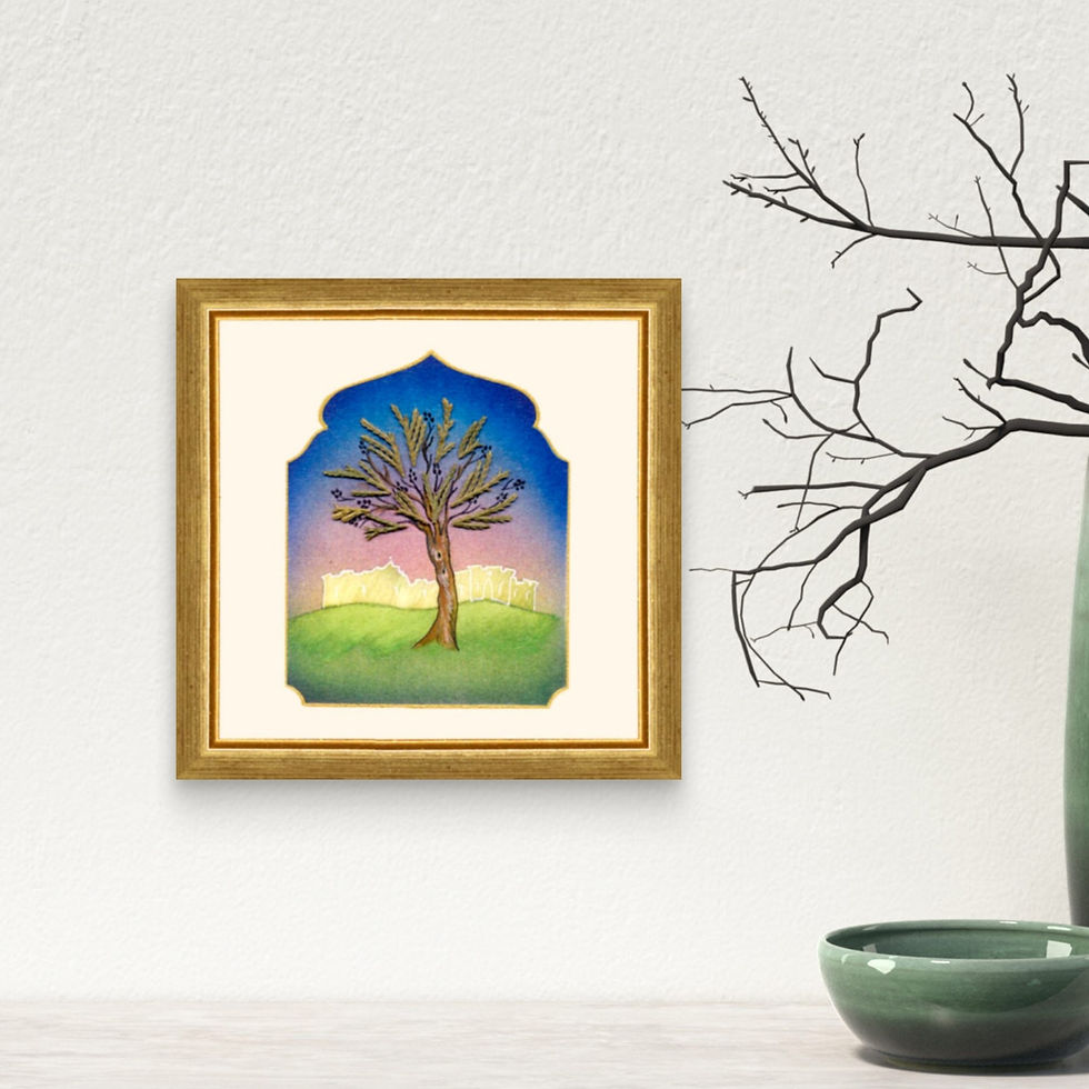 Framed Jerusalem Olive Tree artwork, in a home, hung on a wall above a decorative ceramic jar and bowl placed on a shelf.