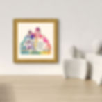 Framed Jerusalem Old City artwork, in a home, hung on a wall above two ceramic sculptures of figures placed on a shelf.