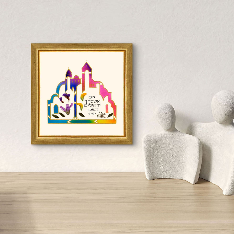 Framed Jerusalem Old City artwork, in a home, hung on a wall above two ceramic sculptures of figures placed on a shelf.