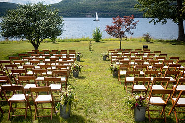 Fall Vermont lakeside wedding ceremony site with natural aisle flowers