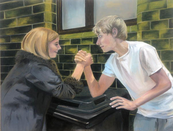 A girl and a boy, arm wrestling on a black bin, in front of a green glossy tiled wall on a side street in Shoreditch, London,  UK.