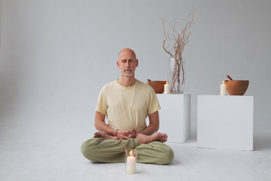 Eric sitting in meditation pose.