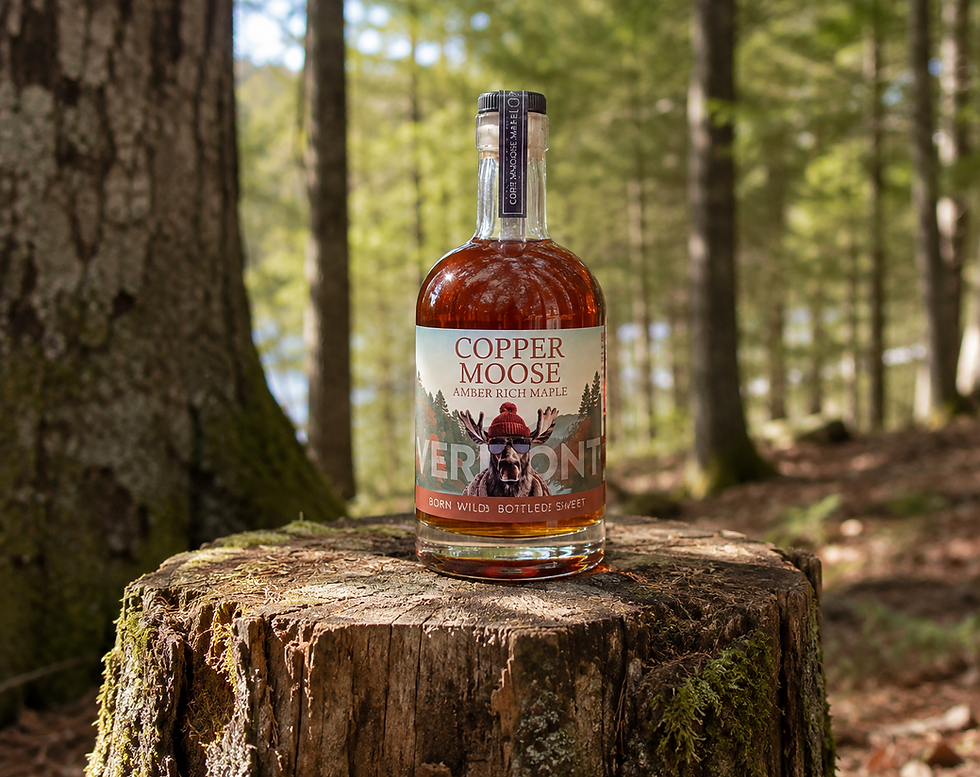 copper moose maple syrup on stump in the woods