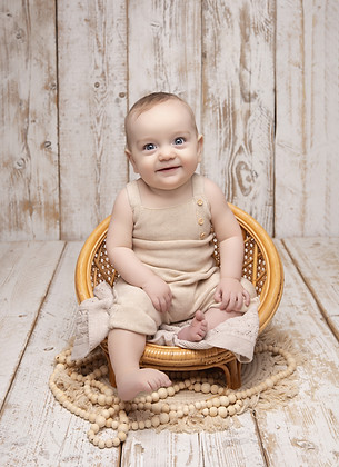 Nine-month-old baby clapping hands during Tiny Teddies milestone session