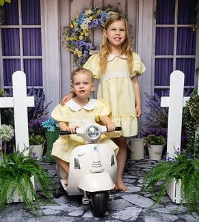 Sisters enjoying spring nursery mini photoshoot