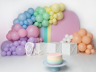 Cake smash portrait session with pastel decorations in Norbury studio