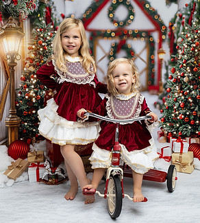Two sisters smiling during nursery photography session in SW16