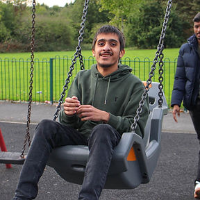 young person on an adaptive swing