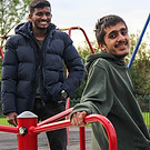 young person on a merry-go-round with adult