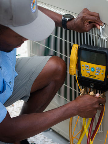 Technician checking AC unit