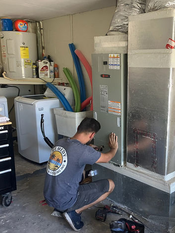 Technician inspecting HVAC unit