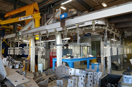 Large Industrial paintline with parts loaded on it