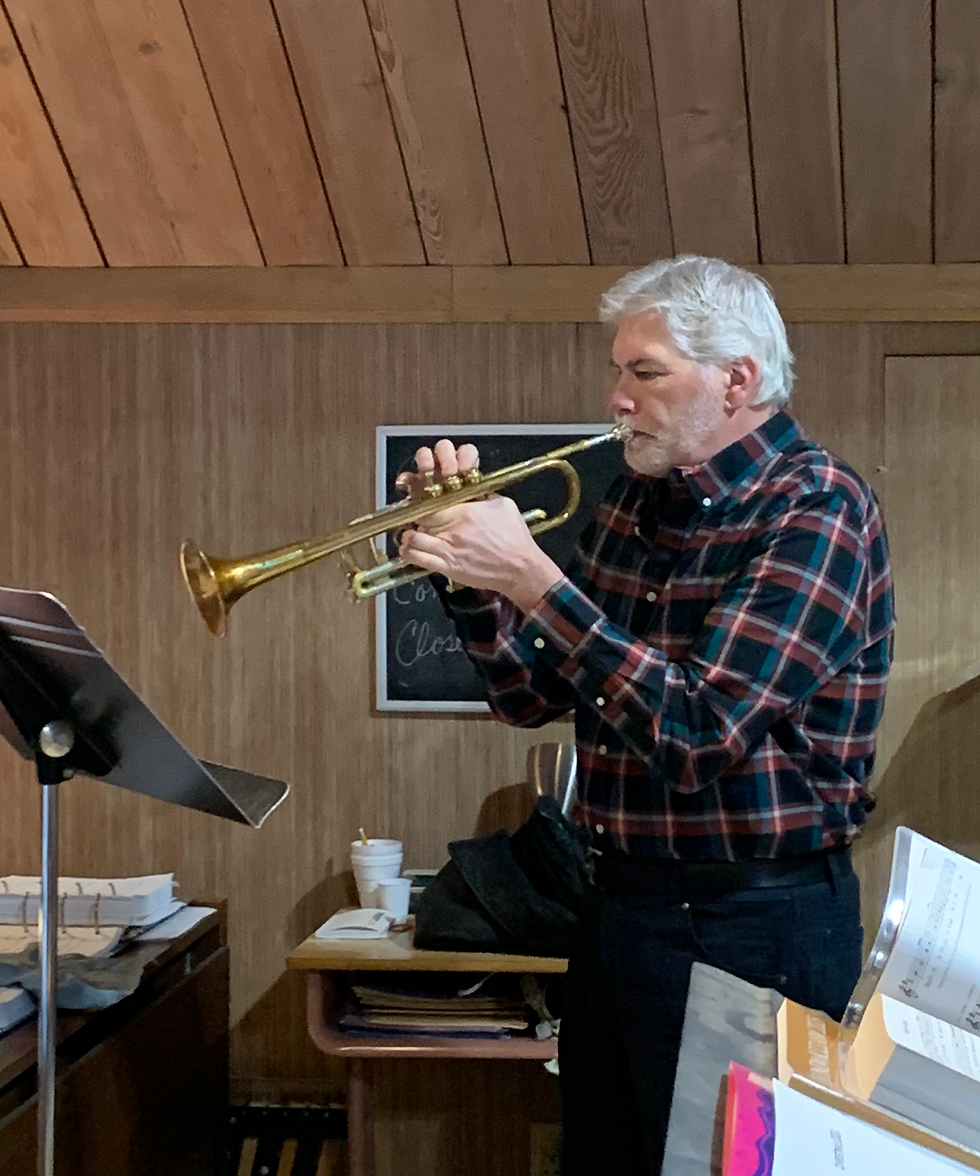 Image of Jim playing trumpet in church.