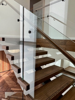 Entry doors. Custom doors Perth. Pivot doors. Hinged doors. Bespoke doors.  Doors by Leon. Doors by Leon Perth. Glass balustrade. Custom glass balustrade. Glass made by Cooling Brothers Glass.  Steel spine. Steel spine stairs. Custom stairs. Stairs Perth. Prestige stairs. Bespoke stairs. Timber stairs.
