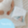 Baby laying on change mat with pack of Purely Baby Disposable Change Mats and Purely Baby logo in bottom corner