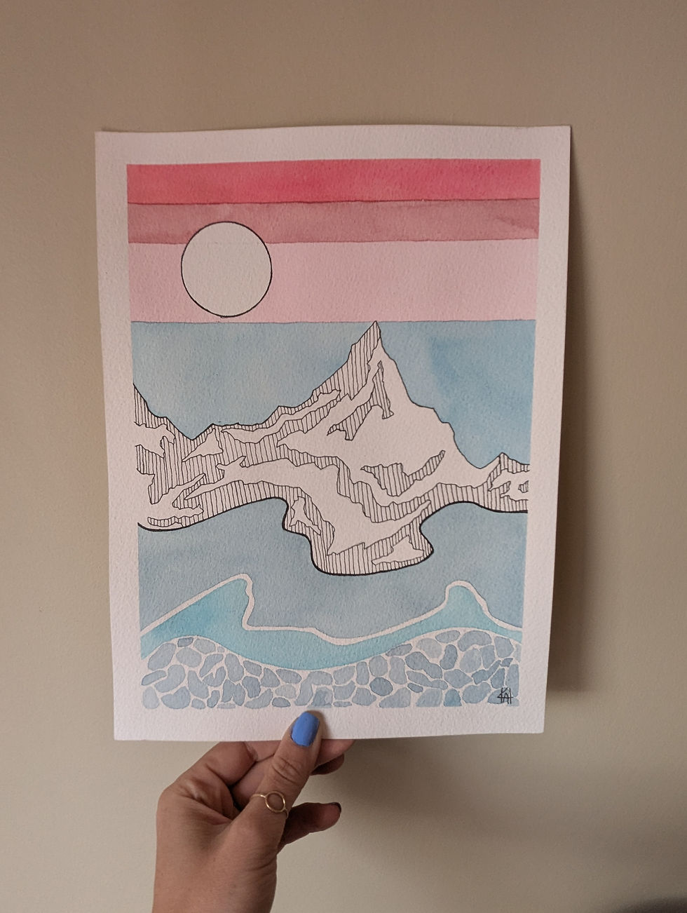 Thumbnail: hand holding watercolour painting with pink lines in the sky around a moon,  mountain drawn with lines in marker