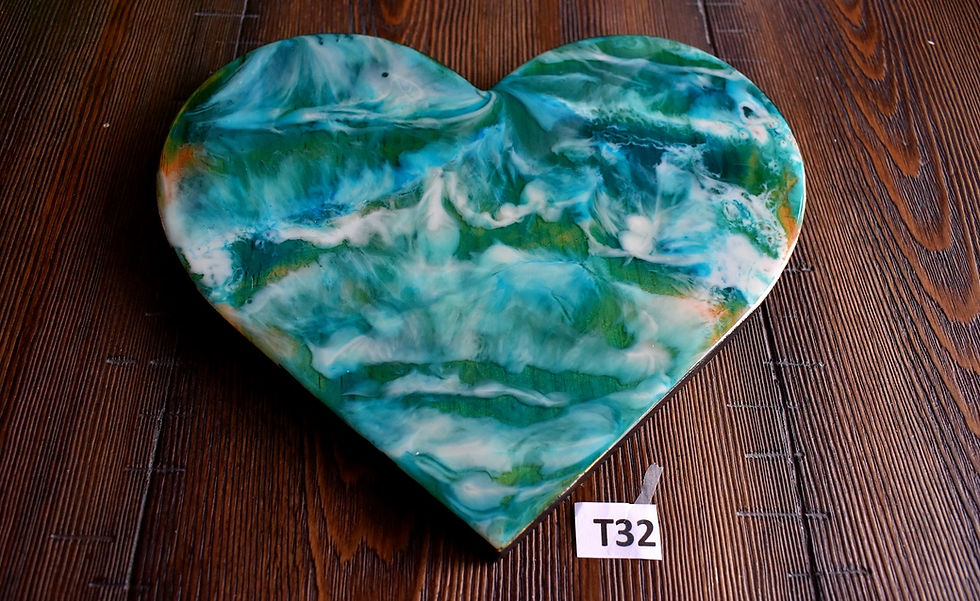 wood heart handpainted with an abstract sea pattern: green, blue-green and white