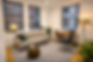 Dr. KC Bugg's professional office workspace with desk and windows overlooking New York City