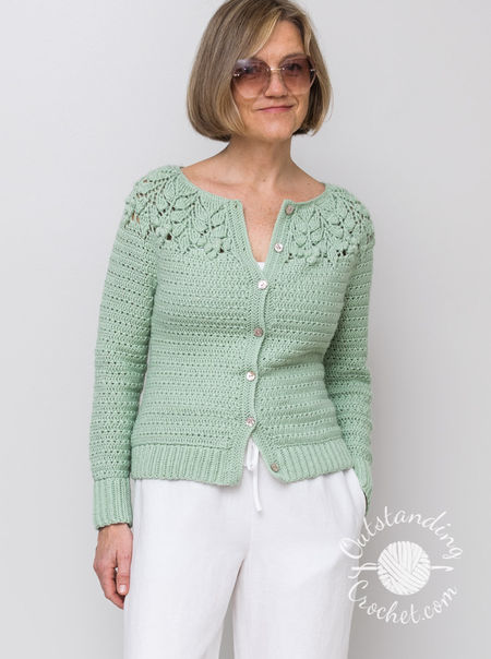 Handmade crochet cardigan worked from the neck down, featuring a textured lace round yoke with intricate embossed branches and berries, buttoned front, short or long sleeves, and rib hem & sleeve finish.