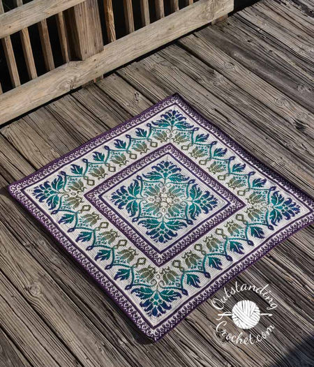 Square mosaic crochet blanket crafted from the center with intricate floral design and beautiful border
