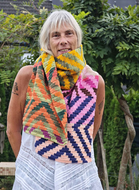 Hand-made crochet scarf in double crochet tapestry technique made with Scheepjes Colour Crafter.