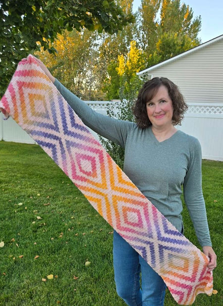 Hand-made crochet scarf in double crochet tapestry technique made with Scheepjes Stone Washed Flow.