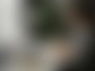 Focused BBA aspirant preparing for entrance exams with books and laptop at a modern desk