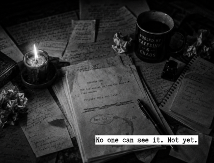 Black-and-white writing desk covered with handwritten notes, a marked-up draft and a pen, with the text “No one can see it. Not yet.”