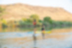 Paddle boarding to blue heart springs in the evening with glassy water on the snake river.