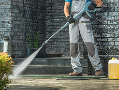 driveway-pressure-washing-caucasian-worker-cleaning-area-front-house_edited.jpg