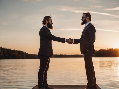 two men in suits with beards shaking hands